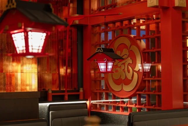 Red lanterns and a gold crest above black dining booths